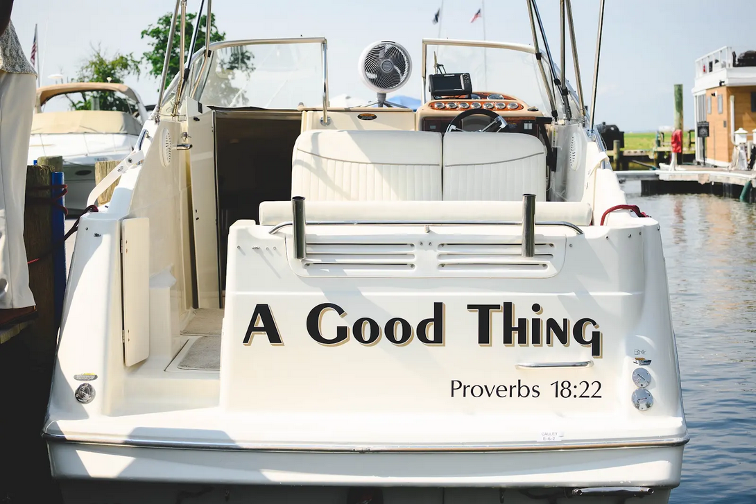 The stern of A Good Thing charter boat docked at the marina, Proverbs 18:22