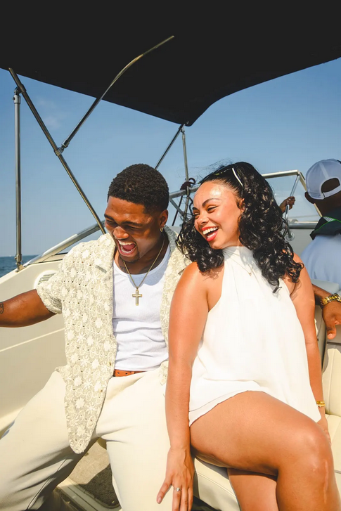Couple laughing together on the boat deck