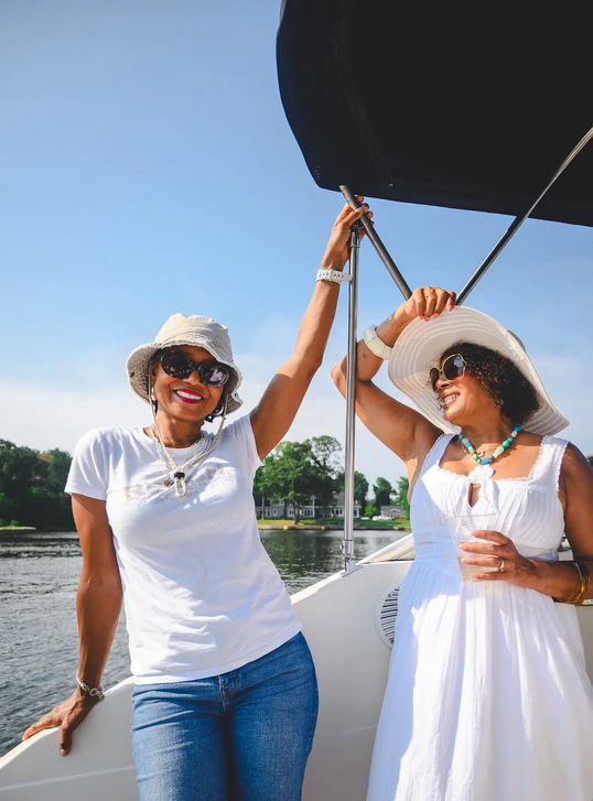 Two women laughing and enjoying themselves on the charter boat